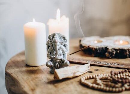 Brown Wooden Table With Candles and Incense